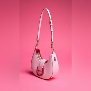 CHARLES & KEITH’s Limited-edition collaboration ITZY Gabine hobo saddle bag.